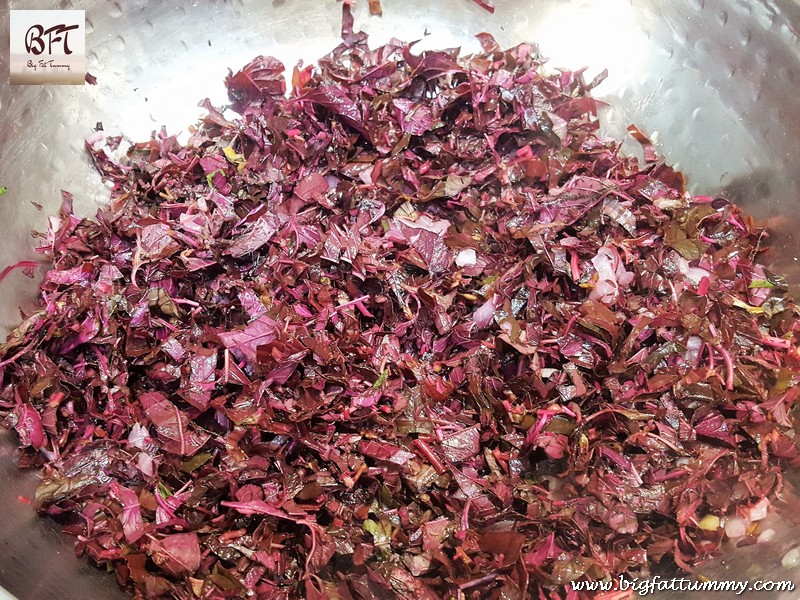 Preparation of Tamde Patol Bhaji (red amaranth in coconut milk)