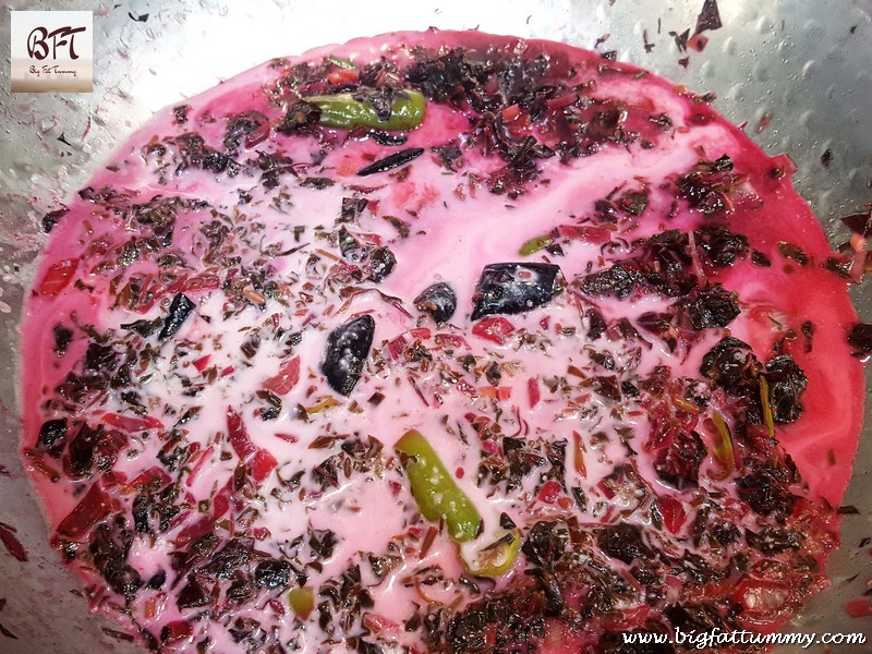 Preparation of Tamde Patol Bhaji (red amaranth in coconut milk)