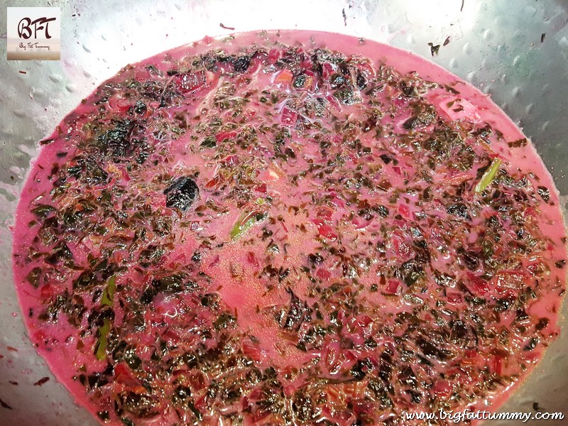 Preparation of Tamde Patol Bhaji (red amaranth in coconut milk)