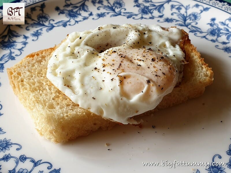 A slice of Bread Loaf - No Knead topped with a fried egg